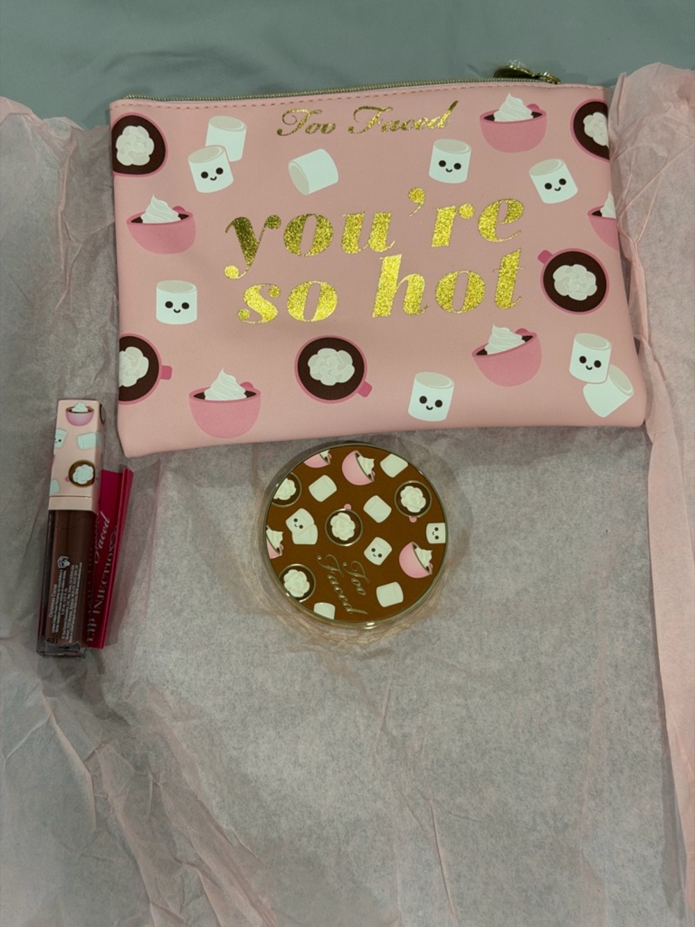 Too Faced pink zip cosmetic pouch with gold foil text